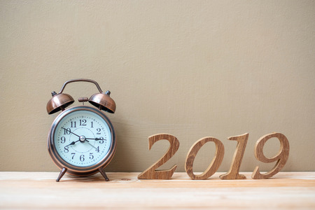 2019 Happy New years with retro alarm clock and wooden number  on table and copy space. New Start, Resolution, Goals and Mission Conceptの写真素材