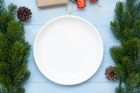 Empty plate with Christmas decoration, preparation for Happy New Year and Xmas Holidaysの写真素材