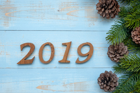 2019 number with Christmas decorations on wooden background, Business Goals, Mission, Resolution, New Year New You conceptの写真素材