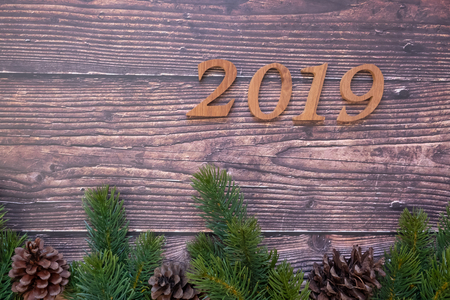 2019 Christmas decoration, gift box and pine tree branches on wooden background, preparation for holiday concept, Happy New Year and Xmas Holidays. Top view and Copy Space for textの写真素材