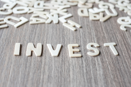 INVEST word of wooden alphabet letters. Business and Idea conceptの写真素材