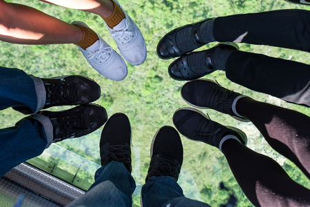 Crystal glass Ngong Ping Cable car with tourists over mountain, to visit the Tian Tan or the Big Buddha located at Po Lin Monastery in Lantau Island. landmark and popular in Hong Kongの写真素材