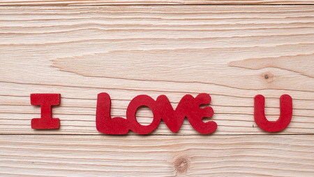 I Love U text on wooden table background. romantic and Valentine Day holiday Conceptの写真素材