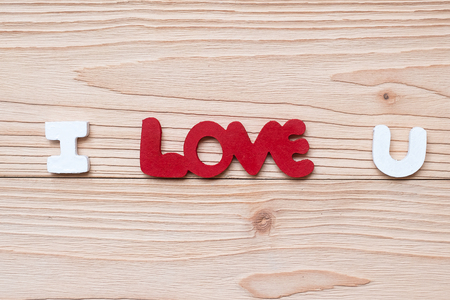 I Love U text on wooden table background. romantic and Valentine Day holiday Conceptの写真素材
