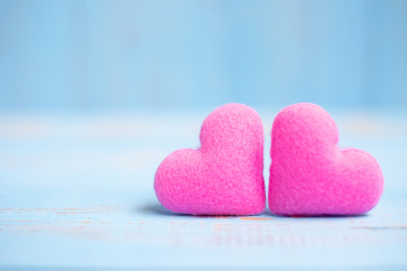 pink couple heart shape decoration on blue wooden table background. Wedding, Romantic and Happy Valentineâ s day holiday conceptの写真素材