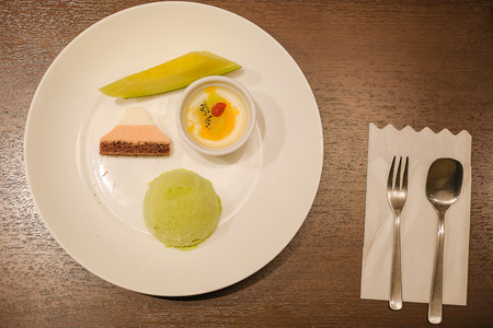 dessert; green tea icecrem, chocolate and fruit on wooden table in Traditional ryokan resort at Kawaguchiko lake, Yamanashi, Japanの写真素材