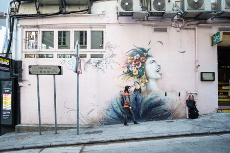 Street art painting or graffiti on the wall at Hollywood road, Hong Kong, Landmark and popular for tourist attraction; Hong Kong, China, 18 December 2018のeditorial素材