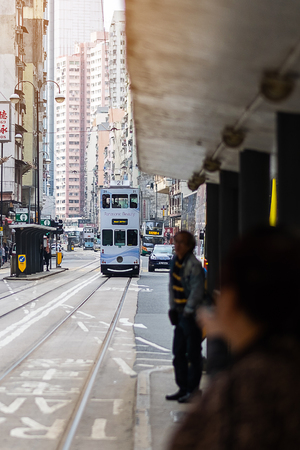 white color Double decker tram on a busy street in Sheung Wan district of Hong Kong Island, symbol of HK; Hong Kong, China, 16 December 2018のeditorial素材