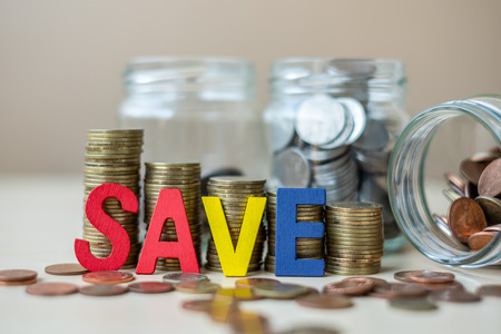 SAVE text with golden coin growing money stairs or stack and glass jar on wooden table. business,...