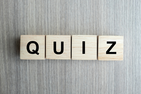 QUIZ text wood cube   on wooden table background.の写真素材