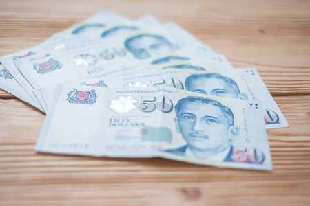 Fifty Singapore Dollars banknote. business, investment, retirement planning, finance and Saving for the future conceptsの写真素材