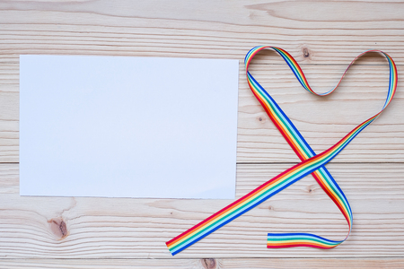 blank paper note for LGBTQ with heart shape Rainbow ribbon for Lesbian, Gay, Bisexual, Transgender and Queer communityの写真素材