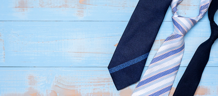 blue necktie on wooden background with copy space for text. Happy Father's Day and International Men's Day conceptsの写真素材
