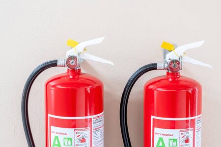 Fire extinguisher system on the wall background, powerful emergency equipment for industrialの写真素材