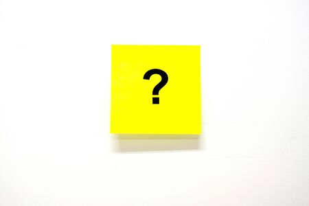 Questions Mark word with note paper on white background.