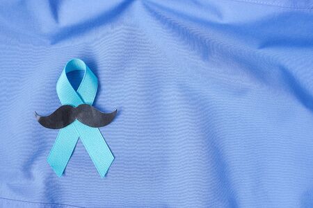 November Prostate Cancer Awareness month, Blue Ribbon on shirt  for supporting people living and illness. Healthcare, International men, Father and World cancer day conceptの写真素材