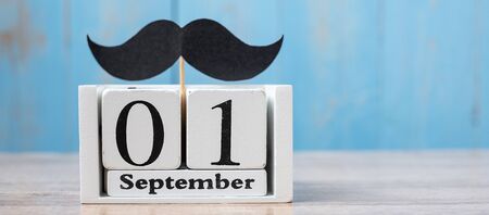1 September Calendar and moustache on wood table background. Father, International men day, Prostate Cancer Awareness and World cancer day conceptの写真素材