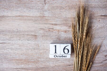 16 October calendar wooden and wheat on table background with copy space. Food Donation, Share, Volunteer and World Food day conceptの写真素材
