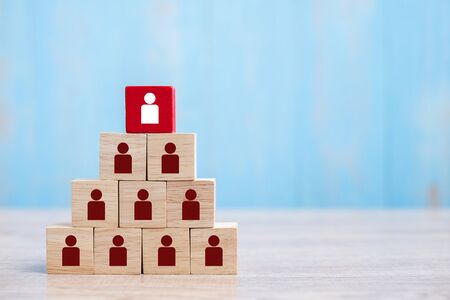 Red wooden block with white person icon on the building. People, Business, Human resource management, Recruitment, Teamwork, strategy and leadership Conceptsの写真素材