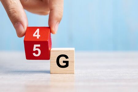 Businessman hand change wooden block from 4G to 5G. Technology, network, communication conceptの写真素材