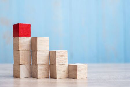 Red wooden block on the building. Business planning, Risk Management, Solution, strategy, different and Unique Conceptsの写真素材
