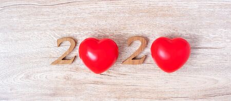 2020 number with red heart shape  on wooden background, health, Insurance and New Year New You conceptの写真素材