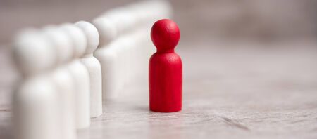 red leader businessman with crowd of wooden men. leadership, business, team, teamwork and Human resource management conceptの写真素材