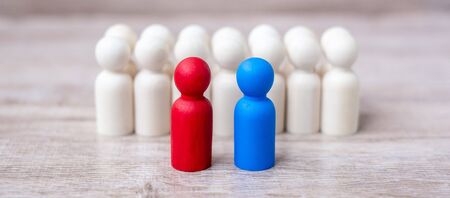 Red and blue businessmen with crowd of wooden men. Candidate, leadership, business, team, teamwork and Human resource management conceptの写真素材
