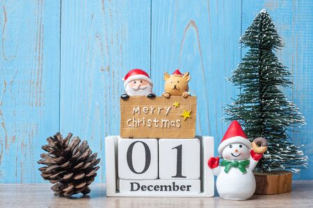 1 December calendar with Christmas decoration, snowman, Santa claus and pine tree  on wooden table background, preparation for holiday, Happy New Year and Xmas Conceptの写真素材