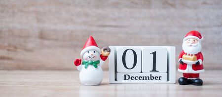 1 December calendar with Christmas decoration, snowman, Santa claus and pine tree  on wooden table background, preparation for holiday, Happy New Year and Xmas Conceptの写真素材