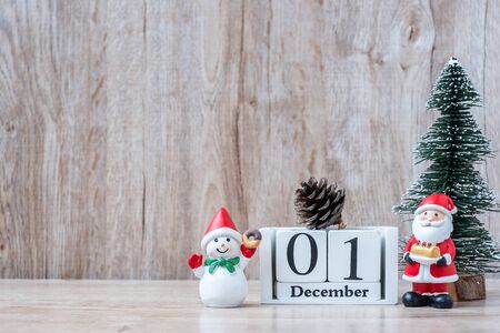 1 December calendar with Christmas decoration, snowman, Santa claus and pine tree  on wooden table background, preparation for holiday, Happy New Year and Xmas Conceptの写真素材