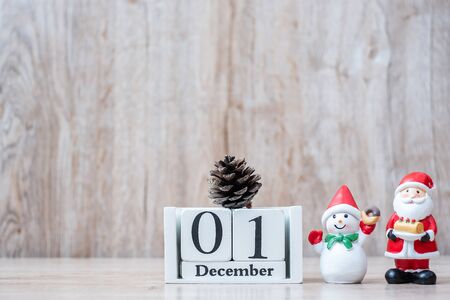 1 December calendar with Christmas decoration, snowman, Santa claus and pine tree  on wooden table background, preparation for holiday, Happy New Year and Xmas Conceptの写真素材