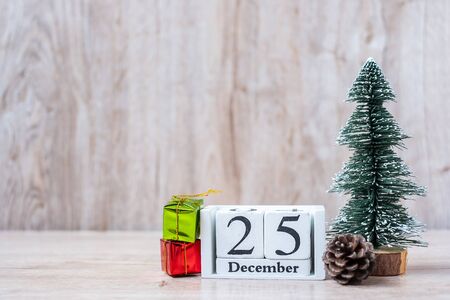 25 December calendar with Christmas decoration, snowman, Santa claus and pine tree  on wooden table background, preparation for holiday, Happy New Year and Xmas Conceptの写真素材