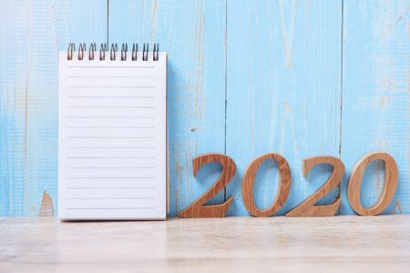 2020 Happy New Year with blank notebook and wooden number. time for a New Start, Resolution, goal, Plan, Action and Mission Conceptの写真素材