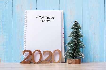2020 New Year Start word on notebook and wooden number. Goal, Resolution, Plan, Action and Mission Conceptの写真素材