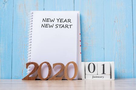 2020 New Year New Start word on notebook and wooden number. Resolution, goal, Plan, Action and Mission Conceptの写真素材