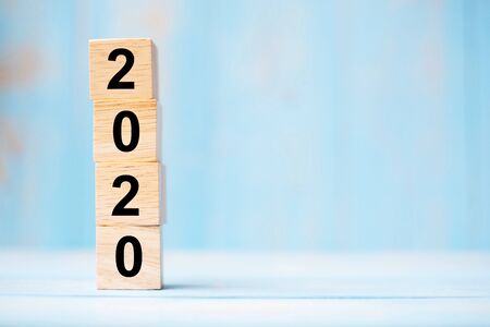 2020 new year wooden cubes on blue table background with copy space for text. Business Goals, Mission, Resolution, New Year New You conceptの写真素材