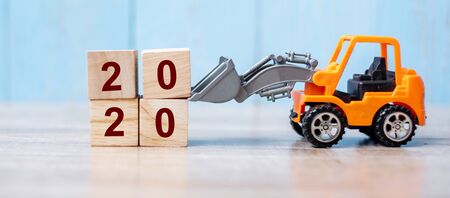 2020 Happy New year with miniature truck or construction vehicle. New Start, Vision, Resolution, goal, industrial, Warehouse conceptの写真素材