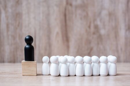black leader businessman with crowd of wooden employees. leadership, business, team, teamwork and Human resource management conceptの写真素材