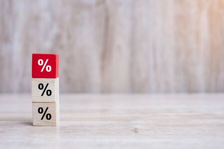 wood cube block with percentage symbol icon. Interest rate,  financial, ranking and mortgage rates conceptの写真素材