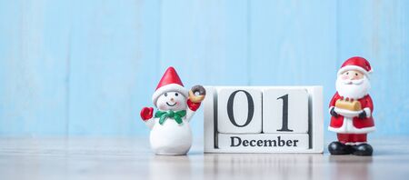 1 December calendar with Christmas decoration, snowman, Santa claus and pine tree  on wooden table background, preparation for holiday, Happy New Year and Xmas Conceptの写真素材