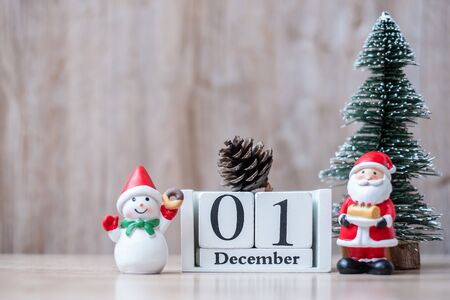 1 December calendar with Christmas decoration, snowman, Santa claus and pine tree  on wooden table background, preparation for holiday, Happy New Year and Xmas Conceptの写真素材