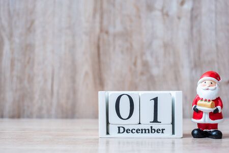 1 December calendar with Christmas decoration, snowman, Santa claus and pine tree  on wooden table background, preparation for holiday, Happy New Year and Xmas Conceptの写真素材