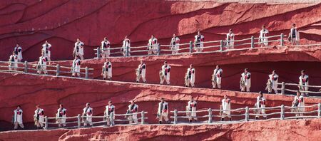 Impression of Lijiang (China outdoor theatre) against Jade Dragon Snow Mountain, is a performance demonstrating the tradition and lifestyle local ethnic people.Lijiang, Yunnan, China, 6 December 2019のeditorial素材