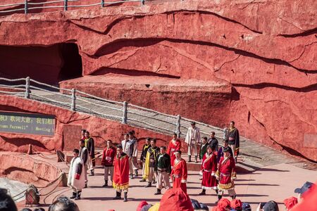 Impression of Lijiang (China outdoor theatre) against Jade Dragon Snow Mountain, is a performance demonstrating the tradition and lifestyle local ethnic people.Lijiang, Yunnan, China, 6 December 2019のeditorial素材