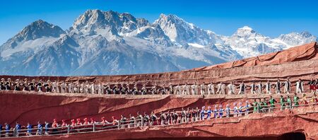 Impression of Lijiang (China outdoor theatre) against Jade Dragon Snow Mountain, is a performance demonstrating the tradition and lifestyle local ethnic people.Lijiang, Yunnan, China, 6 December 2019のeditorial素材