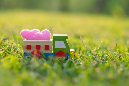 Couple pink heart shape decoration on mini car. Love, Romantic and Happy Valentineâs day holiday conceptの写真素材