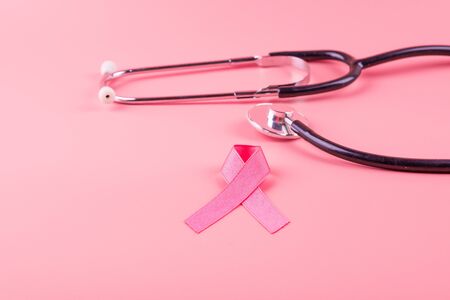Breast Cancer Awareness, Pink Ribbon with Stethoscope for supporting people living and illness. Woman Healthcare and World cancer day conceptの写真素材