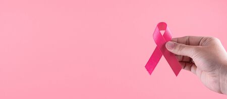 Breast Cancer Awareness month, Pink Ribbon supporting people living and illness. Healthcare, International Women day and World cancer day conceptの写真素材