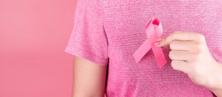 Breast Cancer Awareness month, Pink Ribbon supporting people living and illness. Healthcare, International Women day and World cancer day conceptの写真素材